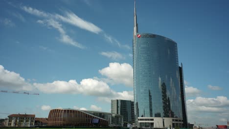 milan unicredit tower and cityscape time lapse with fluffy clouds