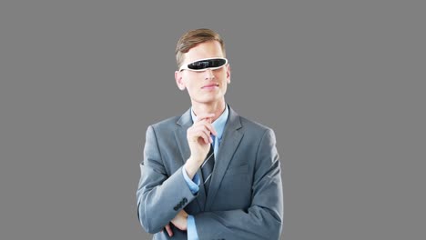 Businessman-in-virtual-video-glasses-using-digital-screen