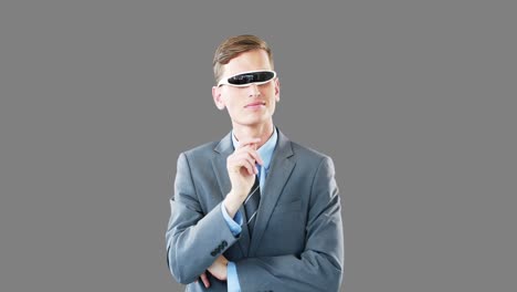hombre de negocios con gafas de video virtuales usando una pantalla digital