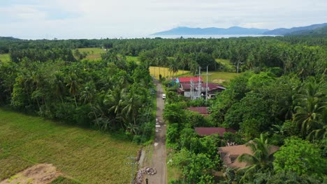 structures along asphalt road at town near barangay san isidro, saint bernard, southern leyte in the philippines