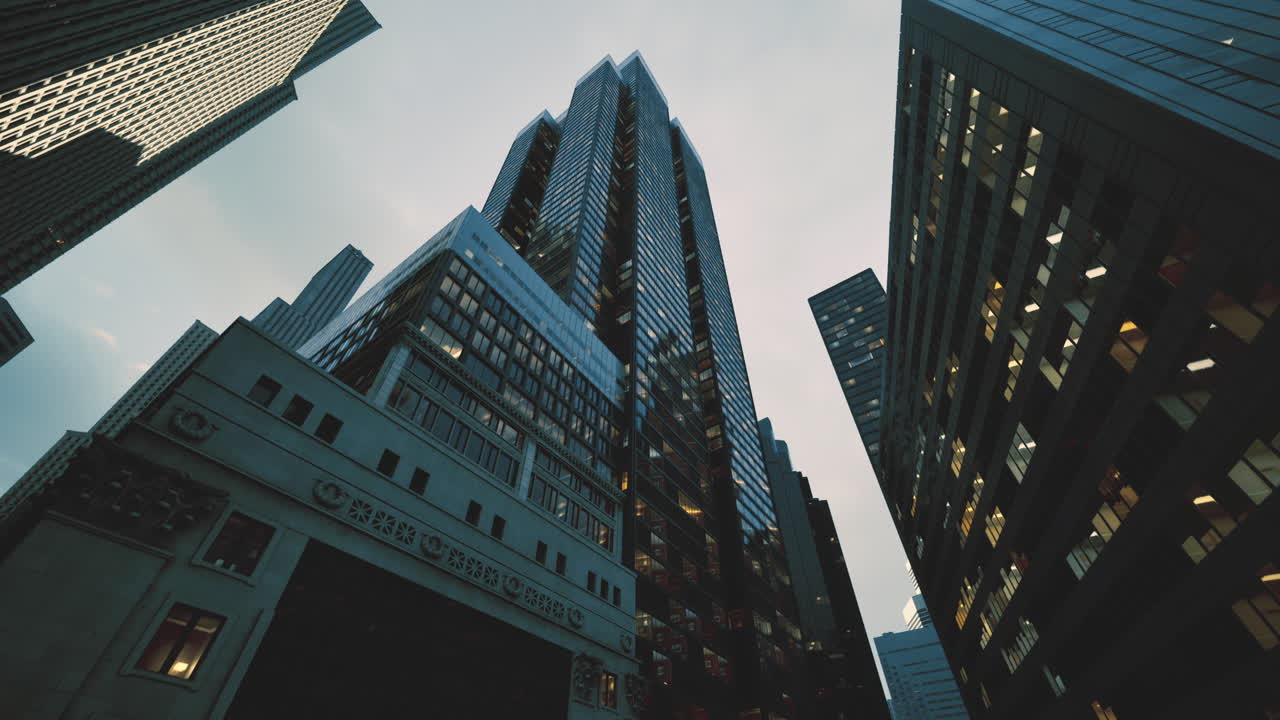 Skyscrapers reaching towards the cloudy sky in a bustling urban neighborhood