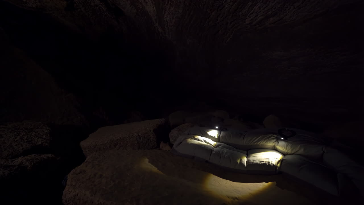 Inflatable Raft Illuminated in a Dark Cave