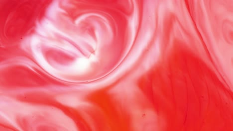 abstract red and white swirling paint texture