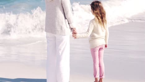 Mother-and-daughter-playing-on-the-beach