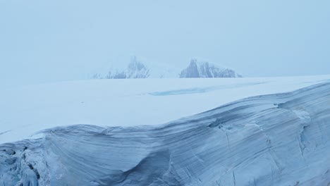 vast glacier and snow-covered mountains in a cold landscape