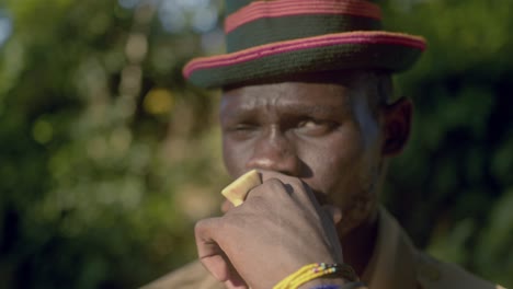 African-Warrior-from-Karamojong-Tribe-Gazes-Directly-at-the-Camera-in-Uganda,-East-Africa---Close-Up