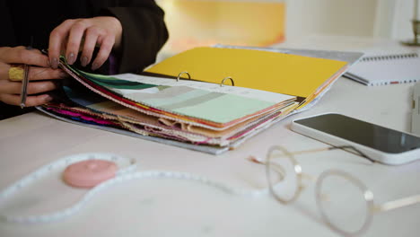 woman hands touching fabric pieces