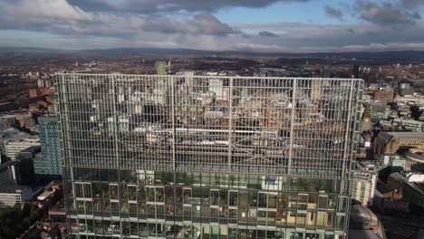 aeril drone flight around the rooftop of the beetham tower giving a view of the penthouse and the surrounding city architecture