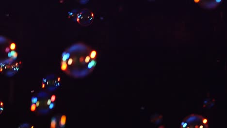 blue red and orange soap bubbles on black background a lot of blue red and orange soap bubbles isolated on black background