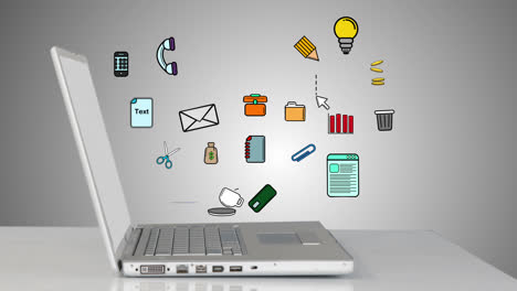 iconos de oficina apareciendo desde la computadora portátil