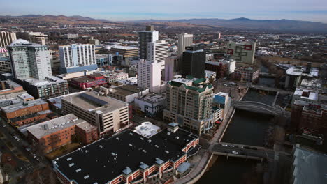 Drone-Shot-of-Downtown-Reno,-Nevada-USA,-Central-Buildings-by-Truckee-River