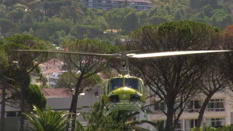 firefighting helicopter collecting water from resovoir