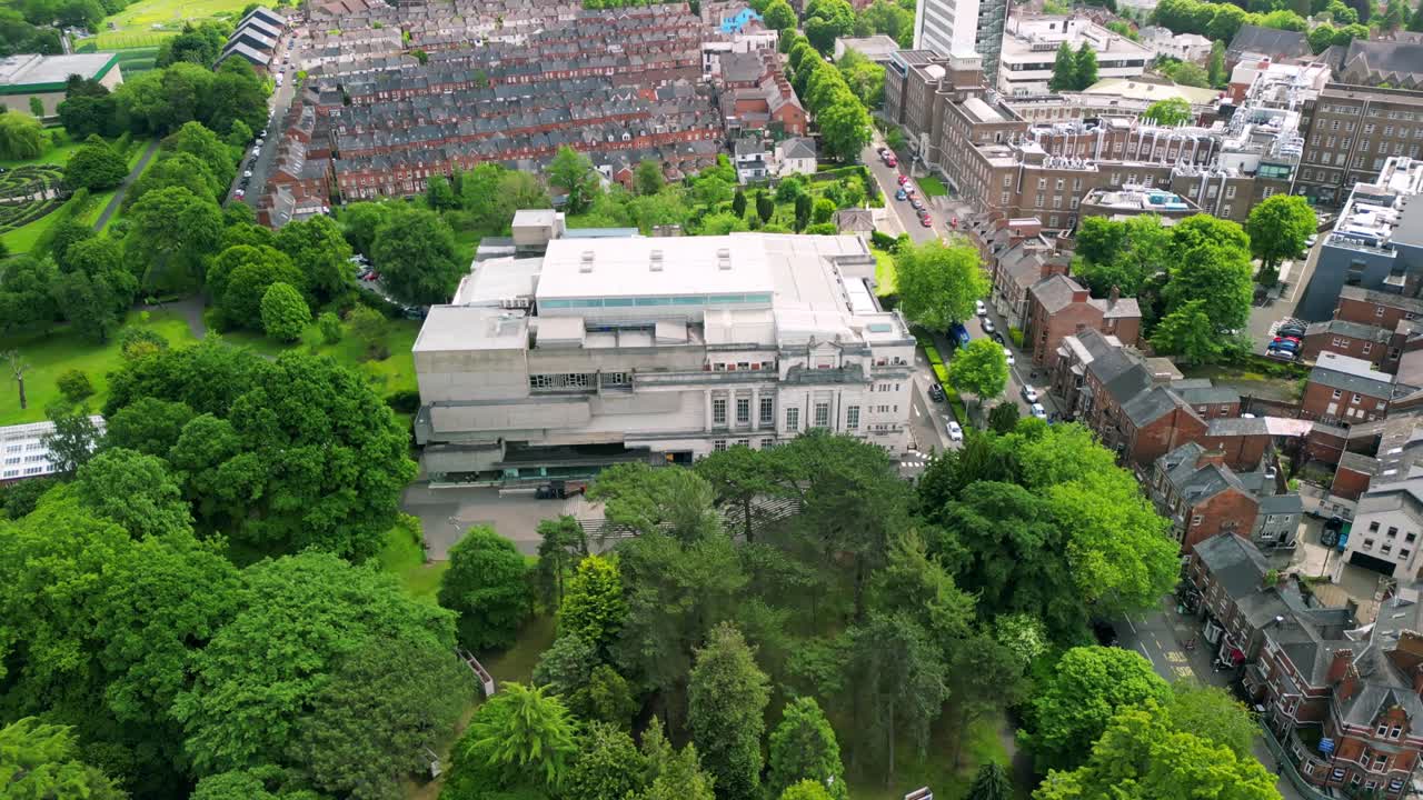 Rotating aerial video of Ulster Museum in Botanic Gardens in Belfast, Northern Ireland on a bright sunny day. Produced in 4K, 30 frames per second and with Rec709 color.