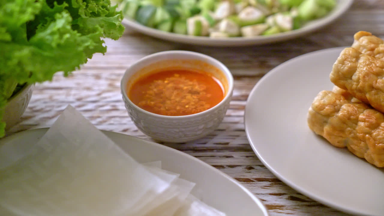 Vietnamese pork  meatball with vegetables wraps (Nam-Neaung or Nham Due) - vietnamese traditional food culture