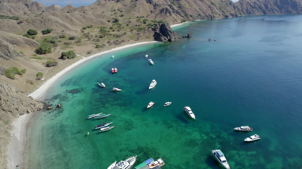 Komodo aerial of the beach and reef on a hot sunny day