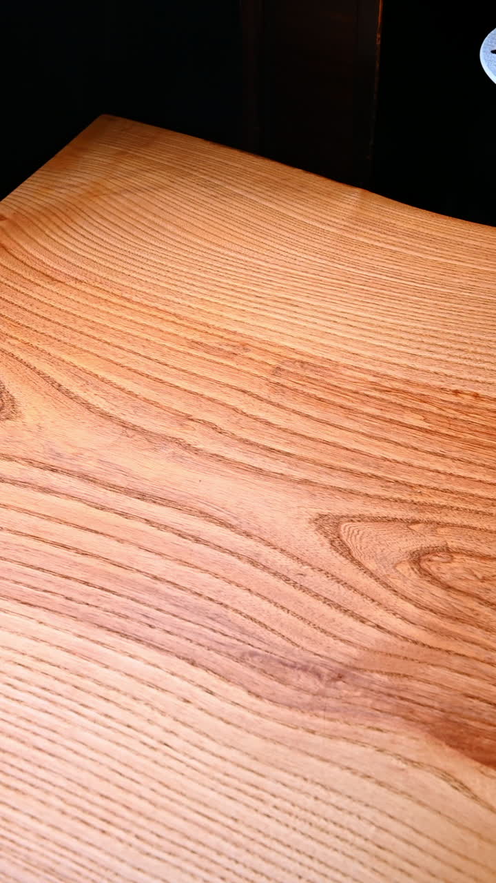 Brunch table with eggs and salad. Warm cafe brunch with fried eggs, green salad and toast arranged on a wooden table