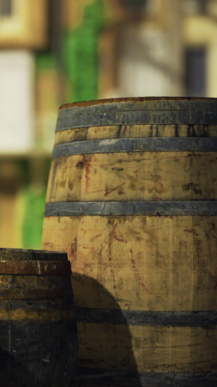 Barrels resting under the warm sun in a charming village street