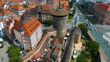 4k aerial drone video of ancient women's gate tower in downtown nurnberg, germany