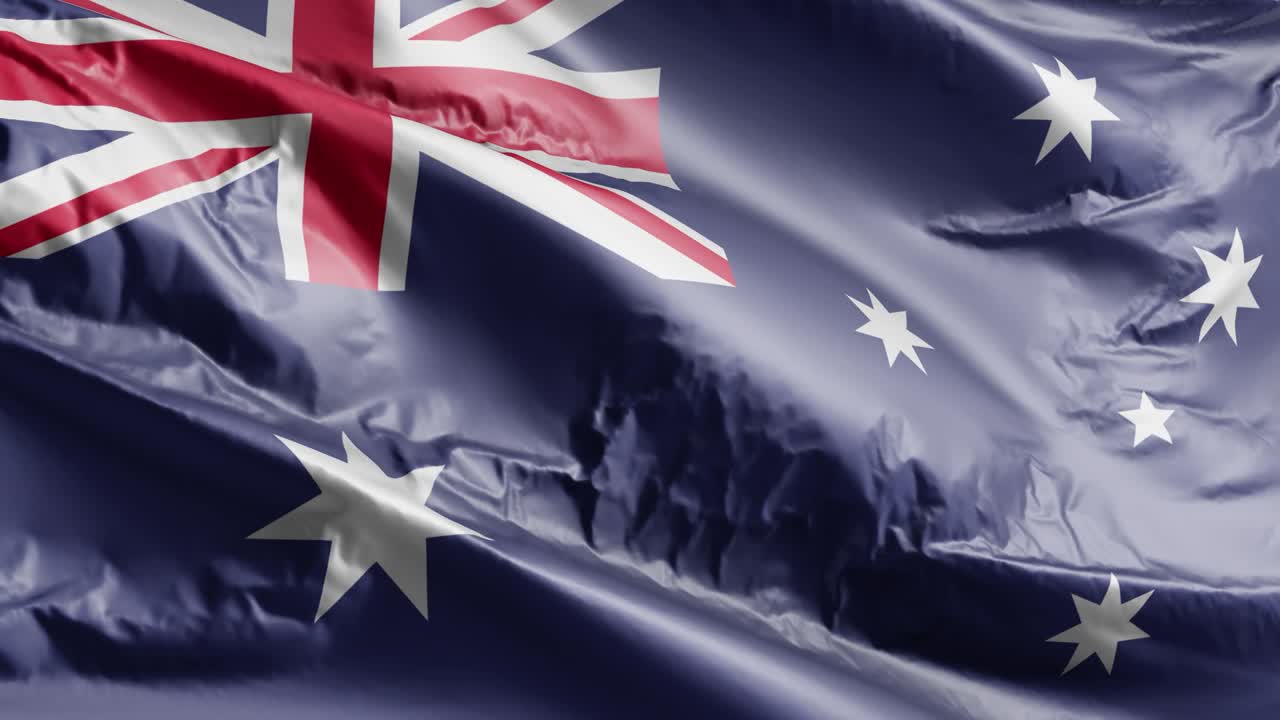 la bandera de australia ondeando en el bucle del viento. la bandera australiana balanceándose en la brisa. fondo de relleno completo. bucle de 10 segundos.