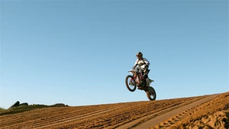 man riding a motor cross bike