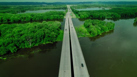 aerial view of highway bridge over flooded river