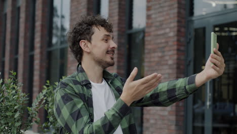 Man making a video call outdoors