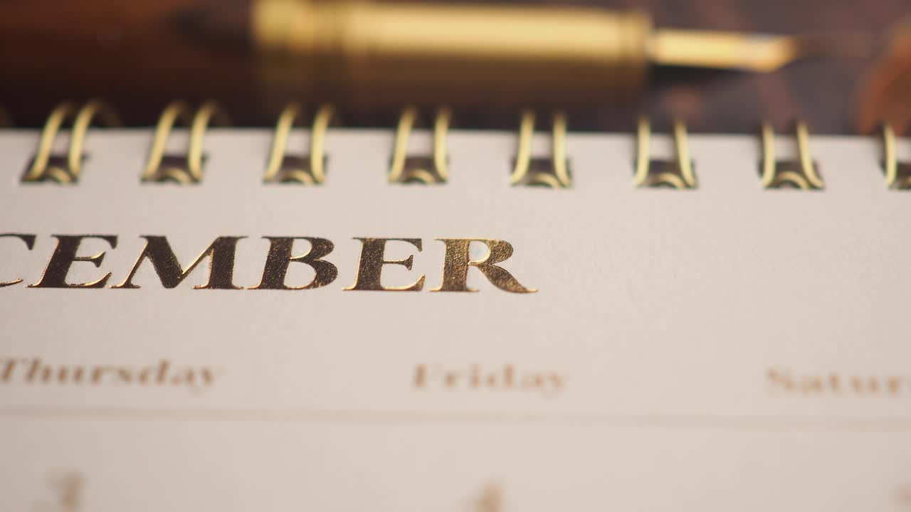 Close-up of December on a Calendar with Golden Letters