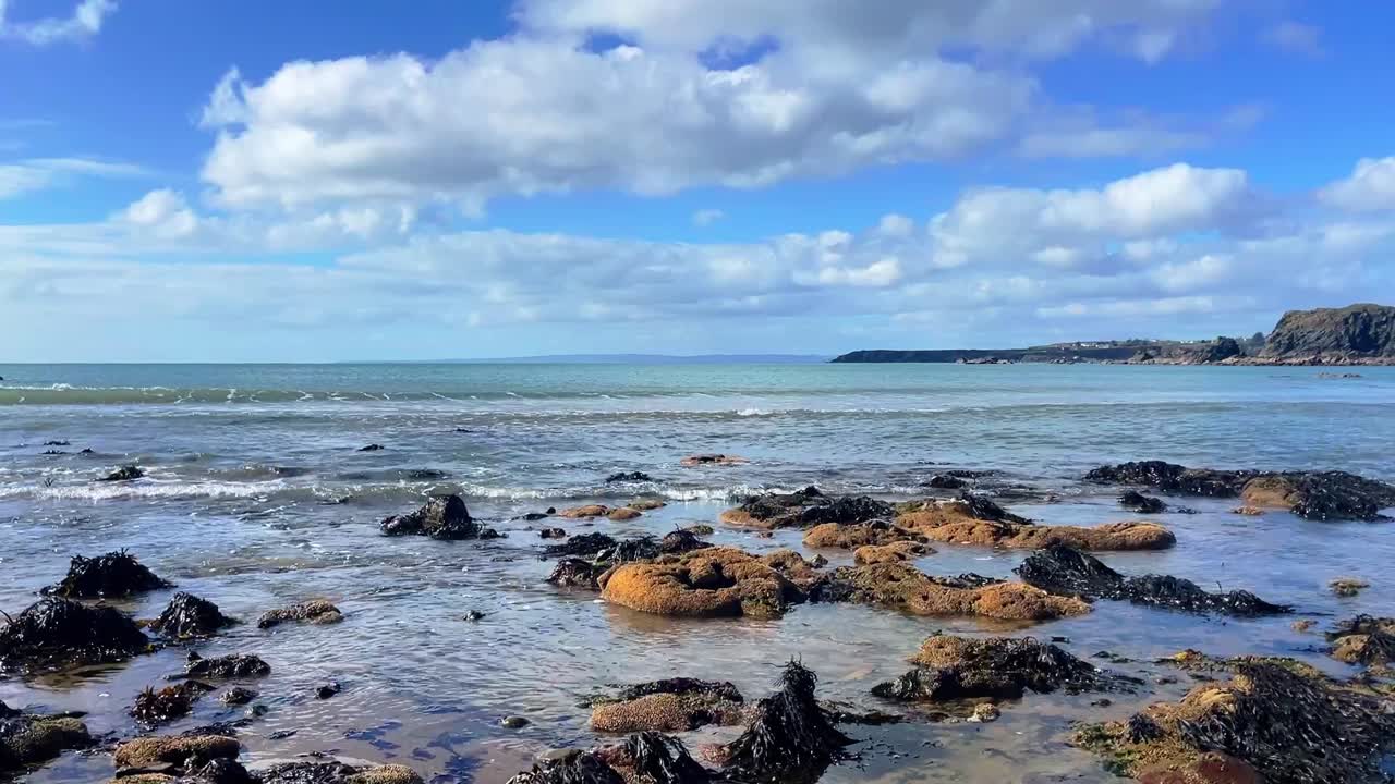 Ireland Epic Locations bright spring day on The Copper Coast Waterford oncoming tides on rocks