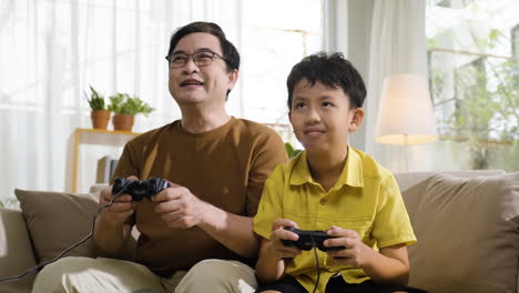 asian man and boy in the living room