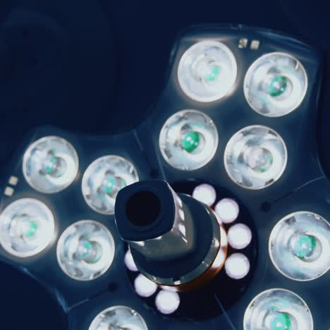 light equipment on ceiling in operating room. modern medical lamp with different bright lamps shining. close-up