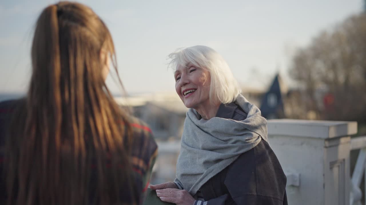 Senior Woman and Young Woman in Conversation