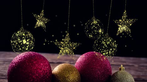 Animation-of-gold-christmas-baubles-and-stars-swinging-over-glitter-decorations-on-black-background