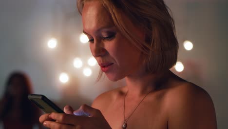 woman texting on phone at night