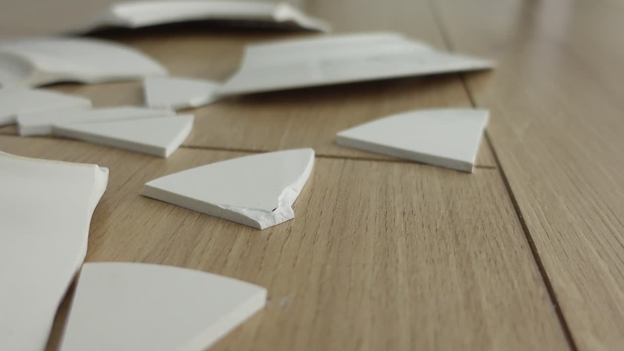 Broken Tile Shards on Floor