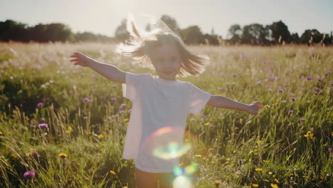 girl playing in a field of flowers on a sunny day