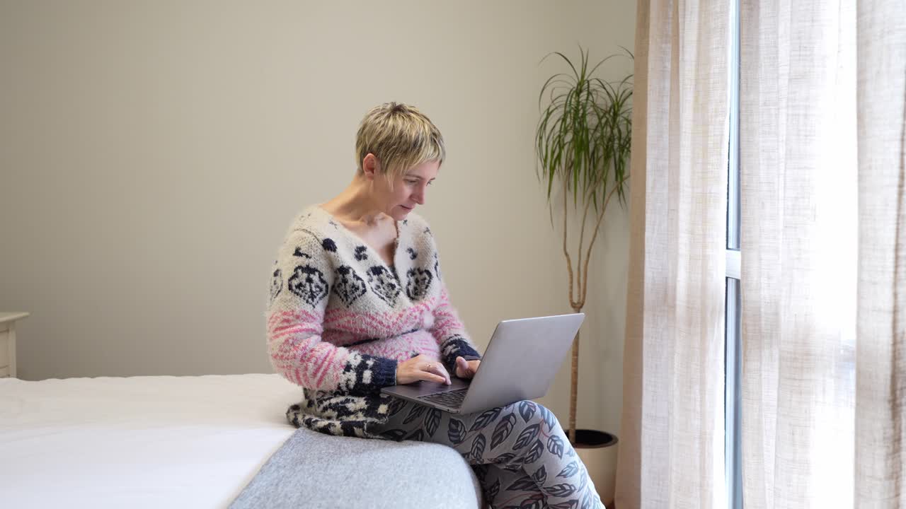 Woman using laptop at home