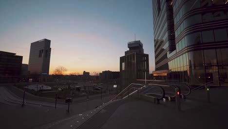 empty streets and closed buildings at the ndsm wharf in amsterdam, netherlands on a sunset - coronavirus outbreak - static shot