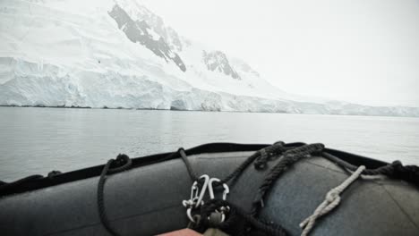 zodiac cruising along glaciated shoreline