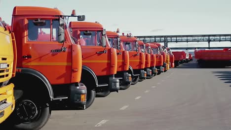 line of orange trucks