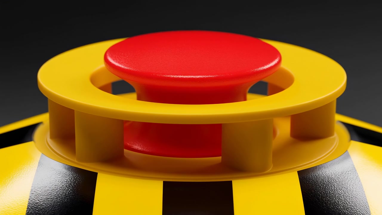 Close-up of a red button-like object centered inside a yellow circular frame on a black and yellow striped base, isolated against a dark background