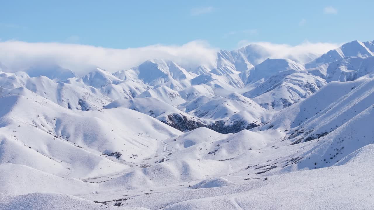 Fresh snow on majestic mountain range, sunny winter day in New Zealand