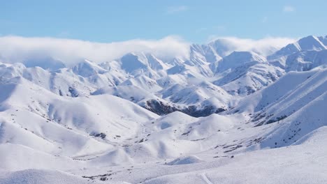 Fresh-snow-on-majestic-mountain-range,-sunny-winter-day-in-New-Zealand