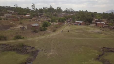 flying my drone above energetic african villagers in malawi africa