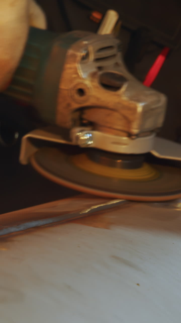 Close-up of Angle Grinder Working on Metal