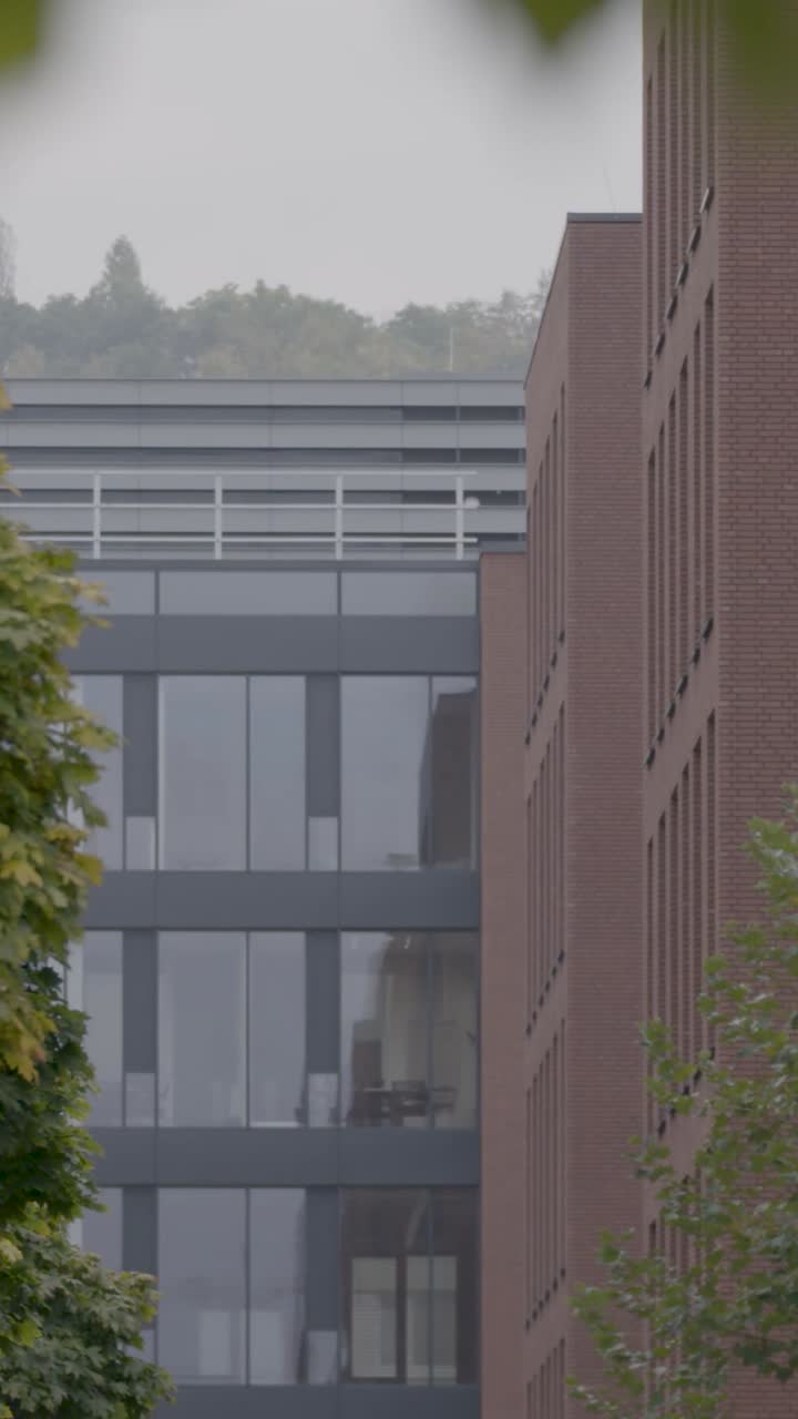 Modern office buildings under cloudy sky, urban architecture scene