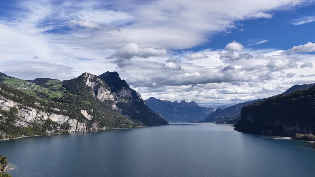 Scenic aerial panorama of Walensee lake with mountain cliffs and forested shores in Switzerland