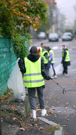 community volunteers cleaning up a city street