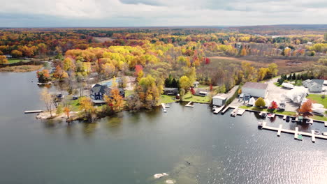 drone shot of a dock in the forrest during fall in the month of october