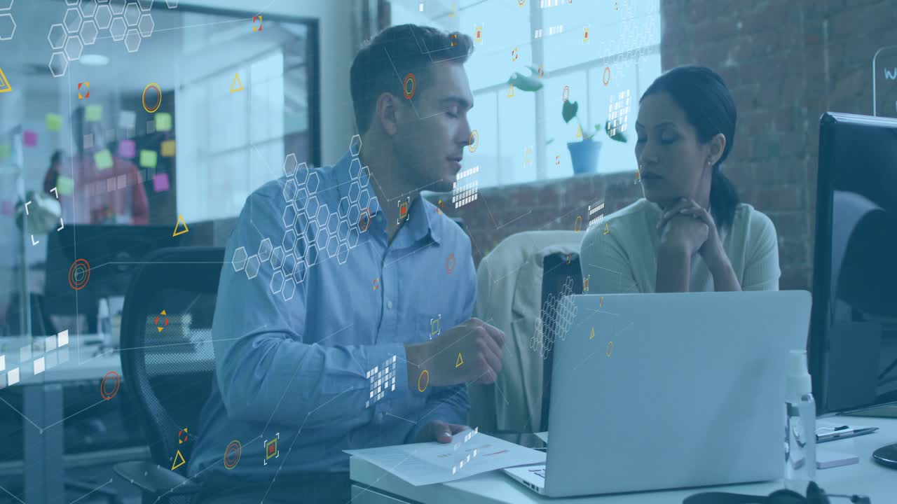 Man tapping paper and pointing at laptop coworkers analyzing data while business charts emerging