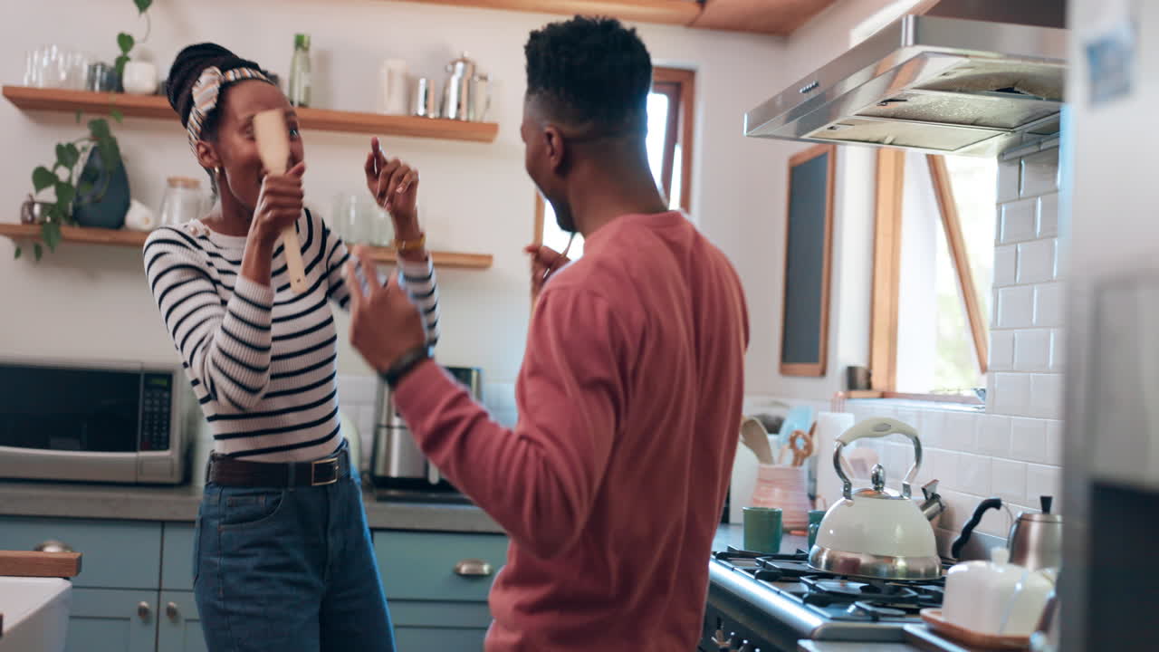 Dance, singing and couple in kitchen for cooking